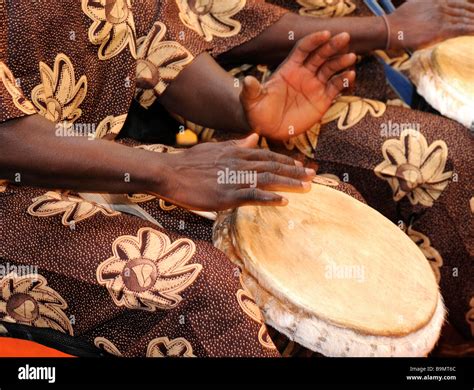 An African Musician Beating The Drum Stock Photo Alamy