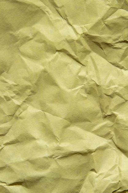 Premium Photo Crumpled Yellow Paper Texture Background