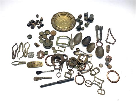 Items Found During Metal Detecting Including Bronze Age Spoons Belt Buckles And Thimbles