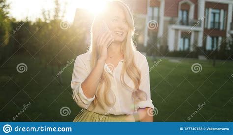 Close Up Of Smiling Attractive Girl With Long Hair Talking On Mo Stock