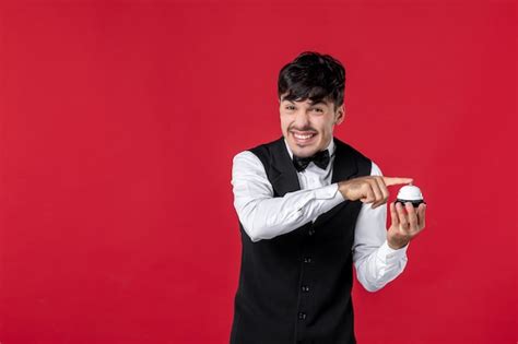 Premium Photo | Top view of smiling funny guy waiter in a uniform with ...