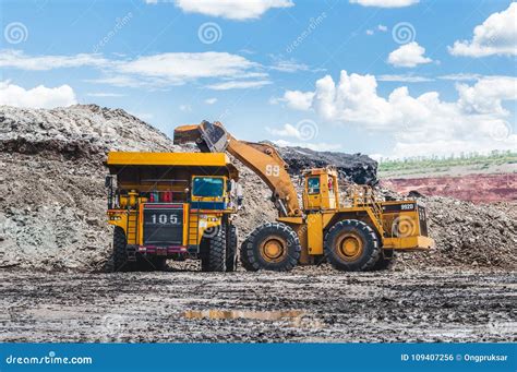 Excavator Loading of Coal, Ore on the Dump Truck. the Big Dump T ...