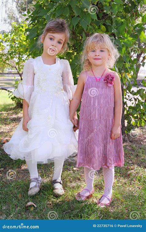 Two Girls Wearing Beautiful Dresses Holding Hands Stock Photo - Image ...