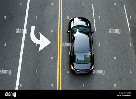 Top View On The Black Car On The Road Yellow Double Solid Line And