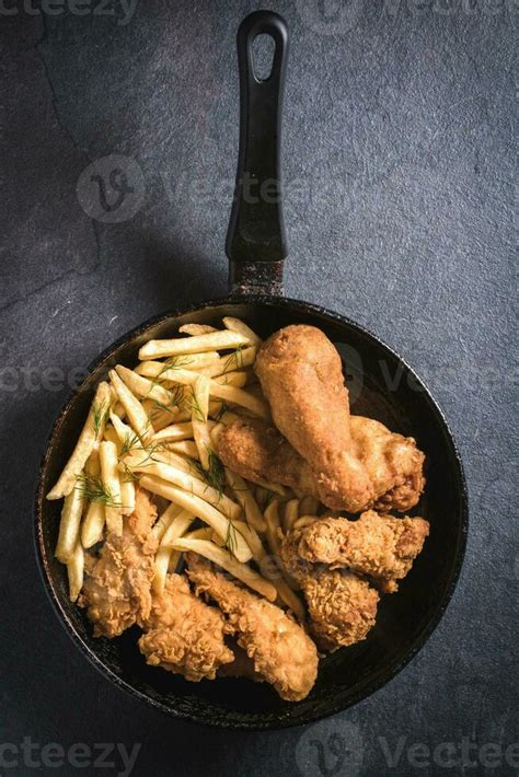 Fried chicken with french fries 23301948 Stock Photo at Vecteezy