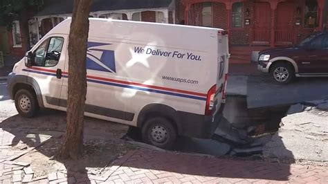 Mail Truck Partially Swallowed Up By Sinkhole On Wilmington Delaware