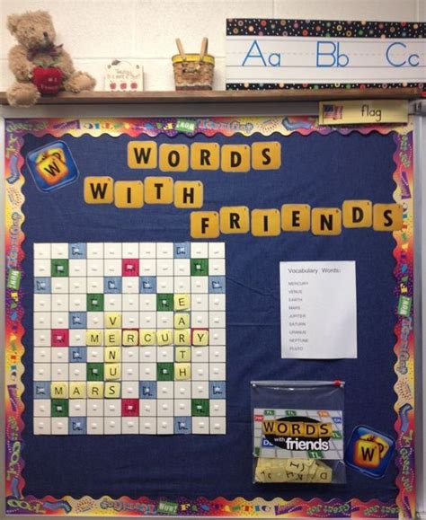 a bulletin board that has words with friends written on it and a teddy bear next to it