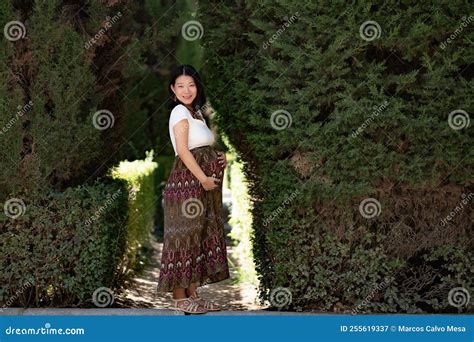 Young Happy And Beautiful Asian Chinese Woman Posing Outdoors Happy And