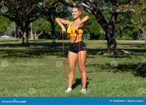 Athletic Woman Workout With Resistance Band Outdoors Fitness Girl