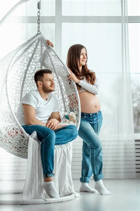 Pregnant Girl With Her Husband Lie On The Bed Beautiful Belly Of A