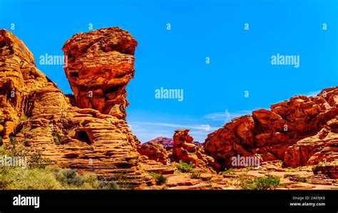 The Erratic Red Aztec Sandstone Formation Near The Arch Rock Campground Under Clear Blue Sky In