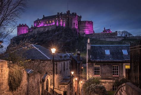 Download Edinburgh Castle In Purple Lights Wallpaper
