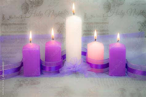 Advent candles for Christmas - fifth candle lit Stock Photo | Adobe Stock