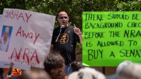 NRA protesters, supporters face off outside gun lobby headquarters