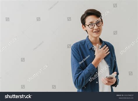 Asian Boy Wearing Eyeglasses Gesturing While Stock Photo 2121794237