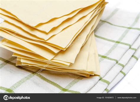 Dried uncooked lasagna pasta sheets Stock Photo by ©repinanatoly 151625672