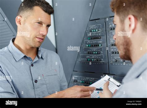 Aero Engineer And Apprentice Working In Hangar Stock Photo Alamy