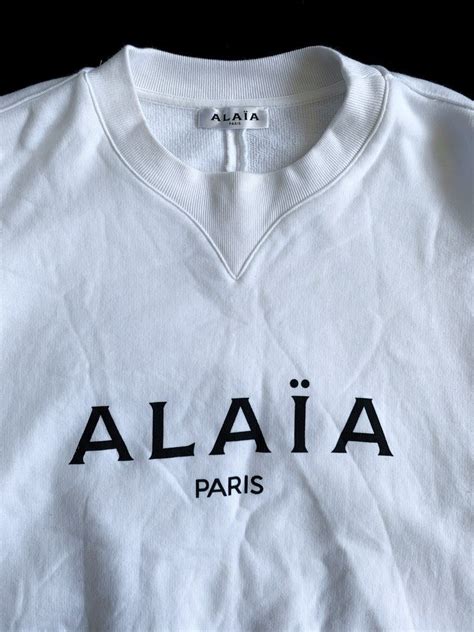 ALAIA PARIS LOGO BOXY WHITE SWEATER on Carousell