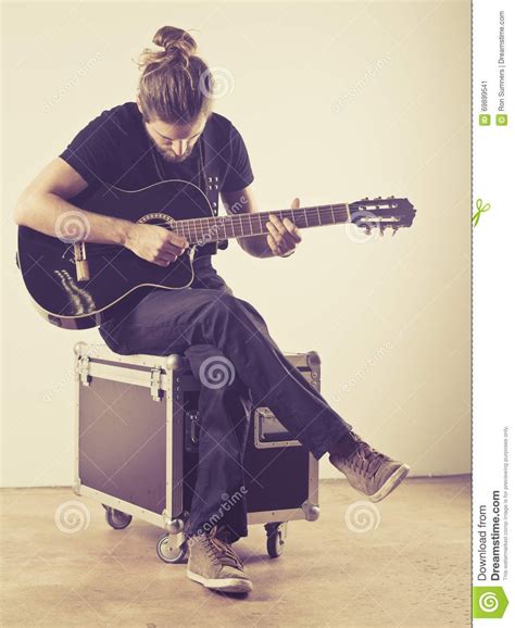 Guitar Player Sitting