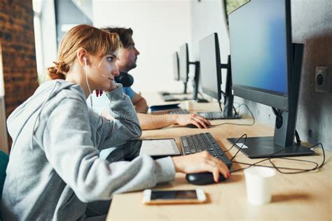 Students Learning In Computer Classroom Young Man Preparing For Test