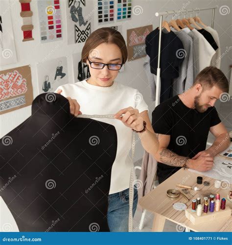 Creative Fashion Designers Team Working In Clothes Design Studio Stock