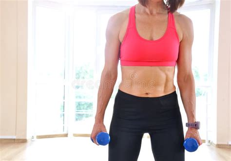 Fitness Mature Woman Warming Up Before Exercising At Home Age