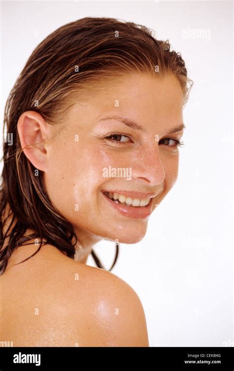 Female Long Wet Brunette Hair Droplets Of Water On Face Looking Back