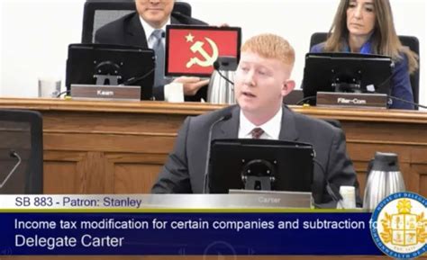 Democratic Lawmaker In Virginia Holds Hammer And Sickle Image Behind