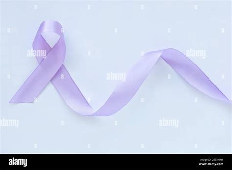 Light Purple Ribbon On White Fabric Isolated Background Copy Space