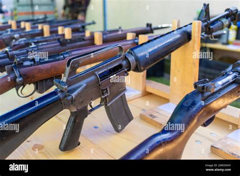 Old American Classic M16 Assault Rifle Among Other Weapons Stock Photo