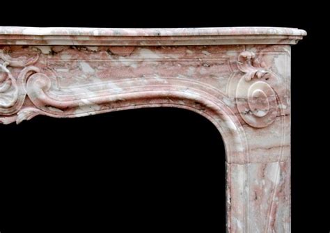 An Antique French Louis Xv Style Fireplace In Norwegian Rose Marble