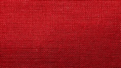 Close Up View Of Red Velvet Fabric Texture With Delicate Folds