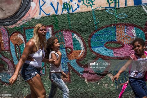 A Girl Cries After Inhaling Tear Gas Fired By The Police As They