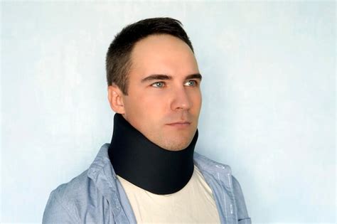 Premium Photo A Sick Man With A Black Collar To Fix A Neck Fracture