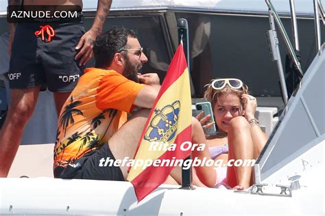 Rita Ora Relaxing On A Boat In Ibiza Spain With Friends In A Purple Bandeau Bikini AZNude