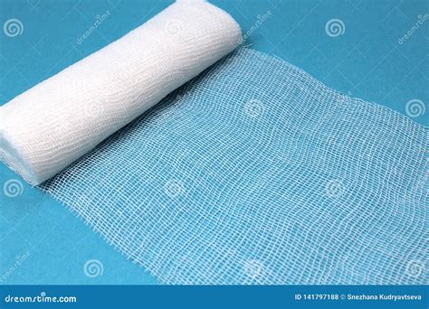 White Sterile Medical Bandage On A Blue Background Stock Photo Image