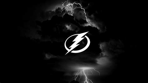 Tampa Bay Lightning Logo With Background Of Dark Clouds And Lightning ...