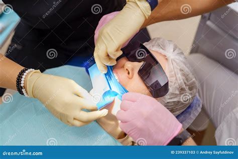 Real Dentist Prepares For Treatment Of Patientand X27s Teeth Stock