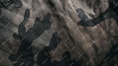 Premium Photo | A black and grey camouflage fabric with a black background