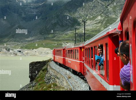 Famous Red Alpine Train Bernina Express From St Moritz To Tirano Passing The Blanc Lake At