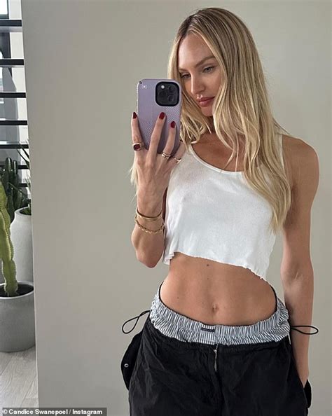 Ex-Victoria's Secret Angel Candice Swanepoel flaunts her toned abs in a