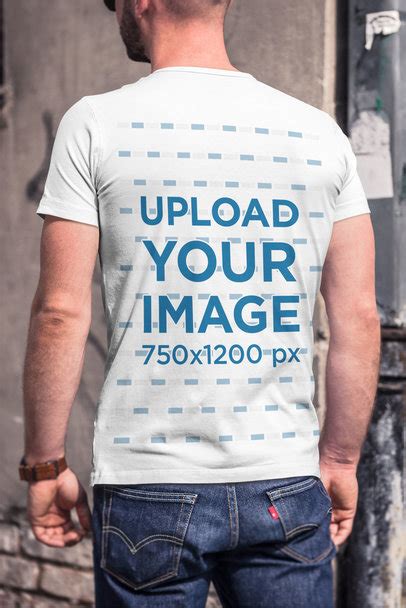 Placeit Back View T Shirt Mockup Of A Man In Front Of A Wall With