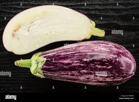 Striped Purple Eggplant Collection Top View Isolated On Black Wood