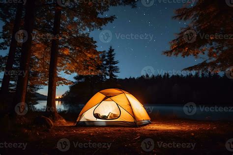 camping tent near trees during night time 28289860 Stock Photo at Vecteezy