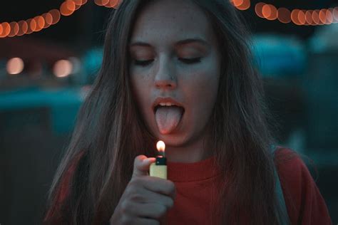 HD Wallpaper Woman Lighting Up Her Tongue Woman Lighting Yellow