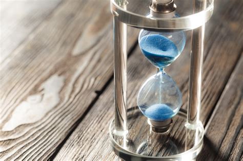 Modern Hourglass On Wooden Photo Premium Download