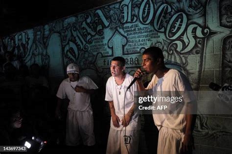 Members of the 18th street gang sings during a press conference at ...