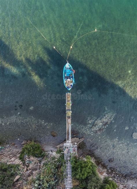 Top Down Aerial View Of A Boat Moored To A Dock Stock Photo Image Of