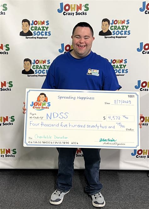 John’s Crazy Socks Sends a Big Check to the National Down Syndrome Soc