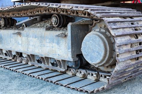 Premium Photo Closeup Of Metal Tracks Of A Crawler Crane With Steel